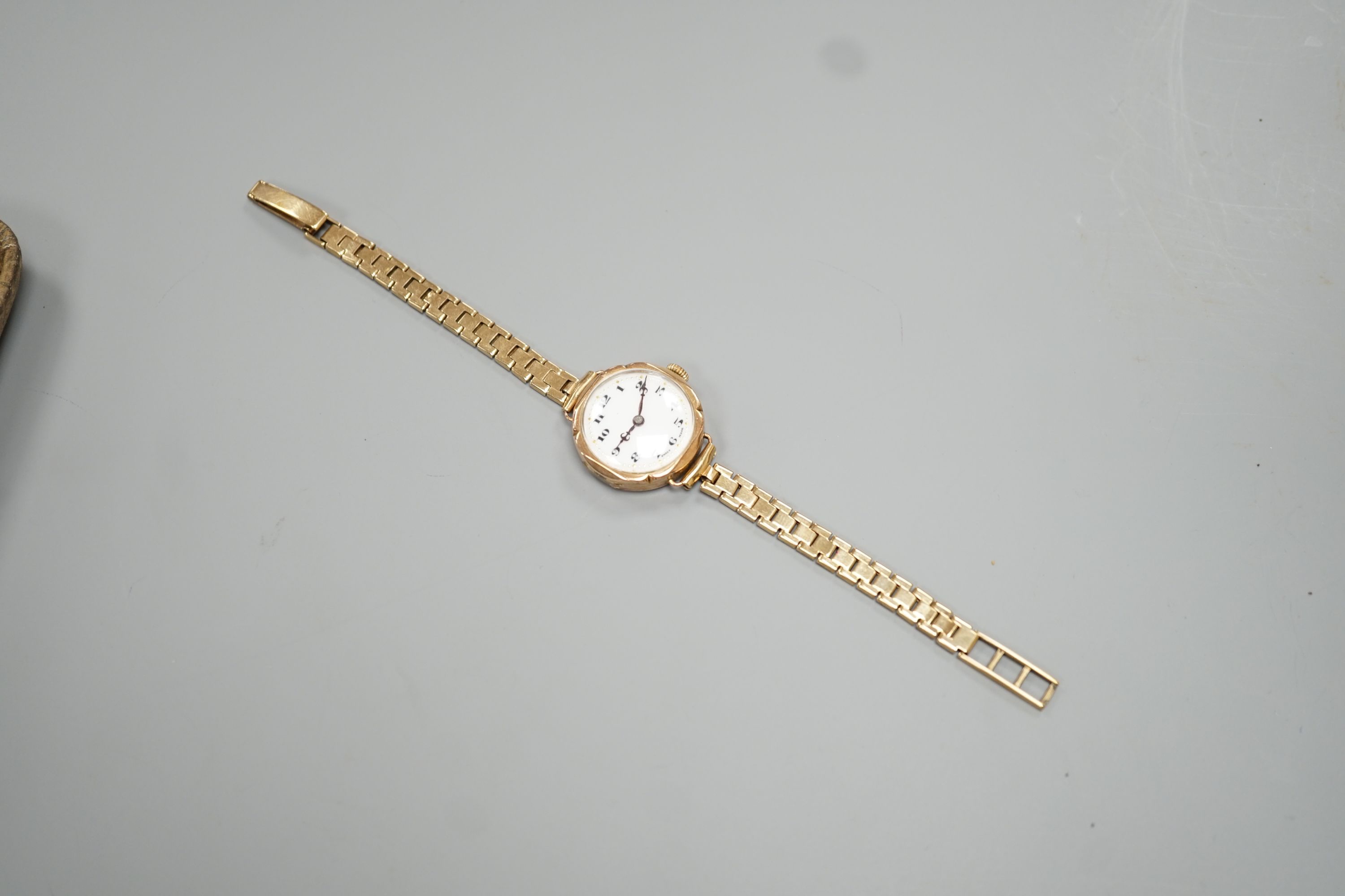 A lady's early 20th century 9ct gold Rolex manual wind wrist watch, on an associated 9ct gold bracelet